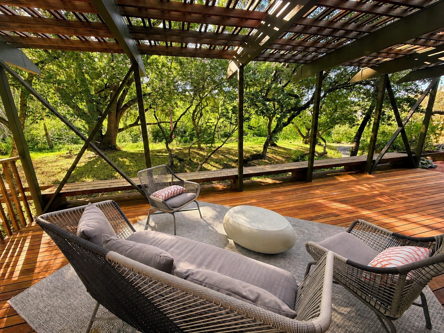 Deck seating under a slatted pergola